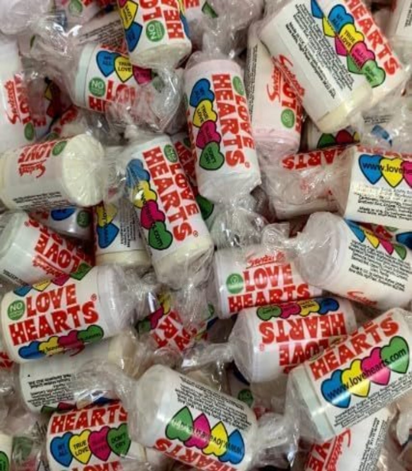 Pile of Love Hearts candy in packaging
