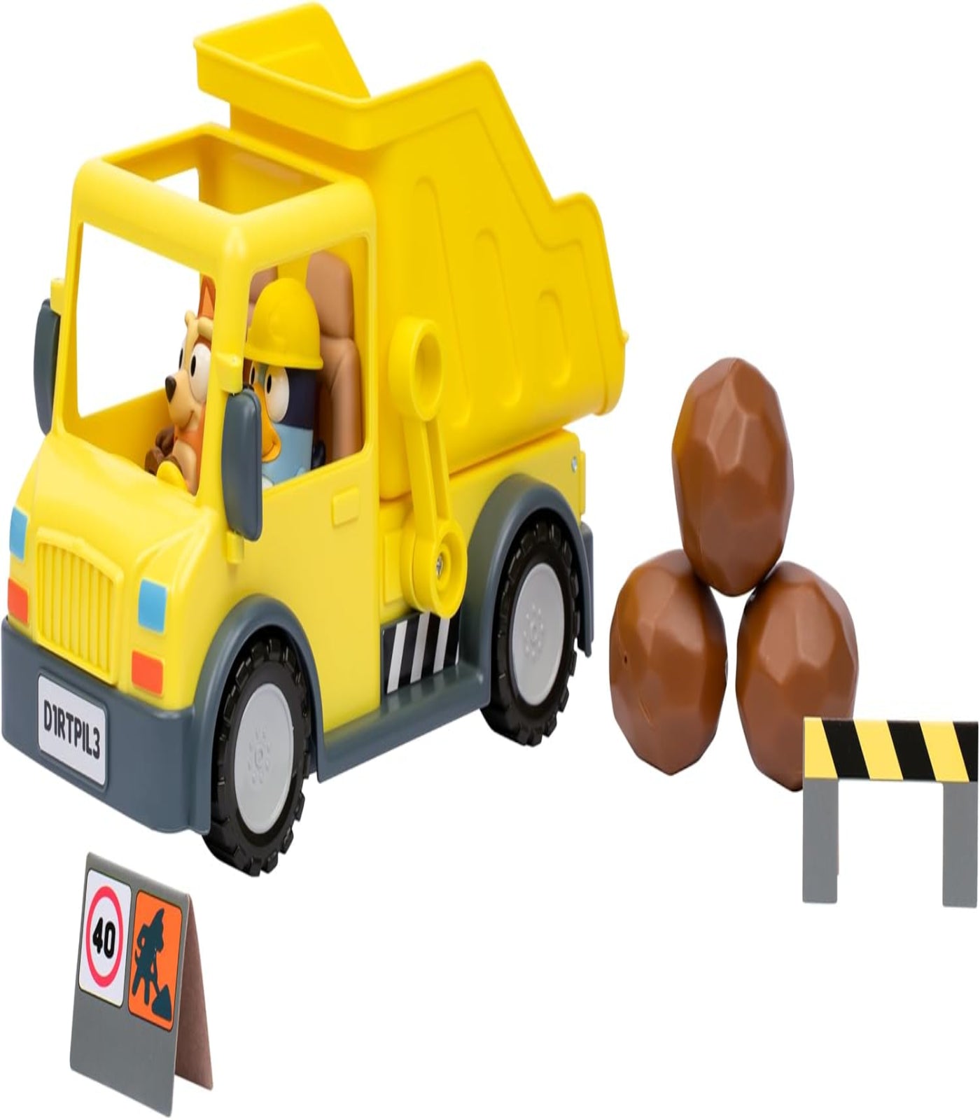 Toy dump truck with a driver figure, rocks, and traffic signs on a white background