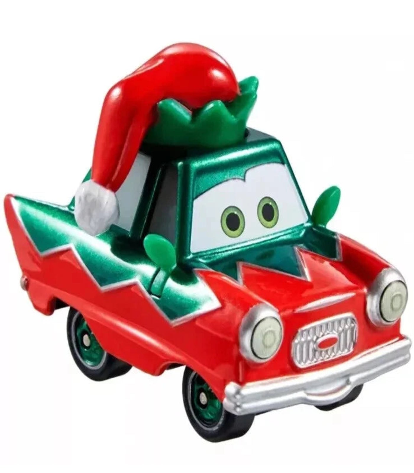 Toy car with a Santa hat and green leaves on a white background