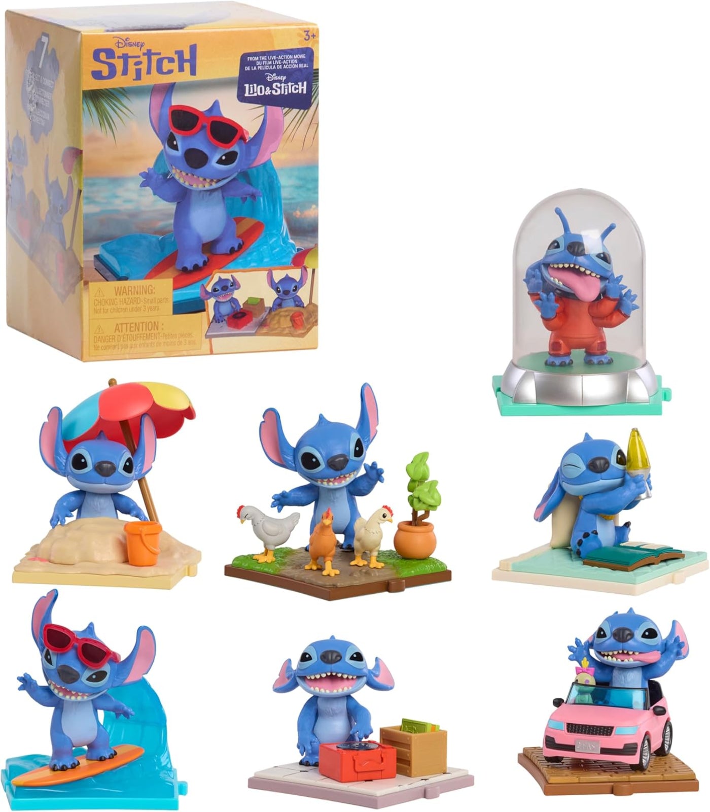 Collection of Stitch figurines with various poses and accessories, including a box in the background.
