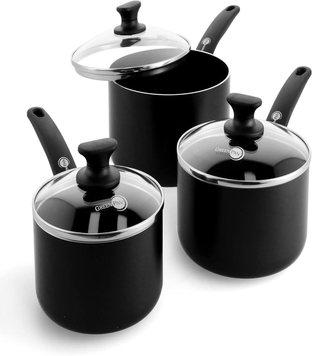 Set of black cookware with glass lids on a white background