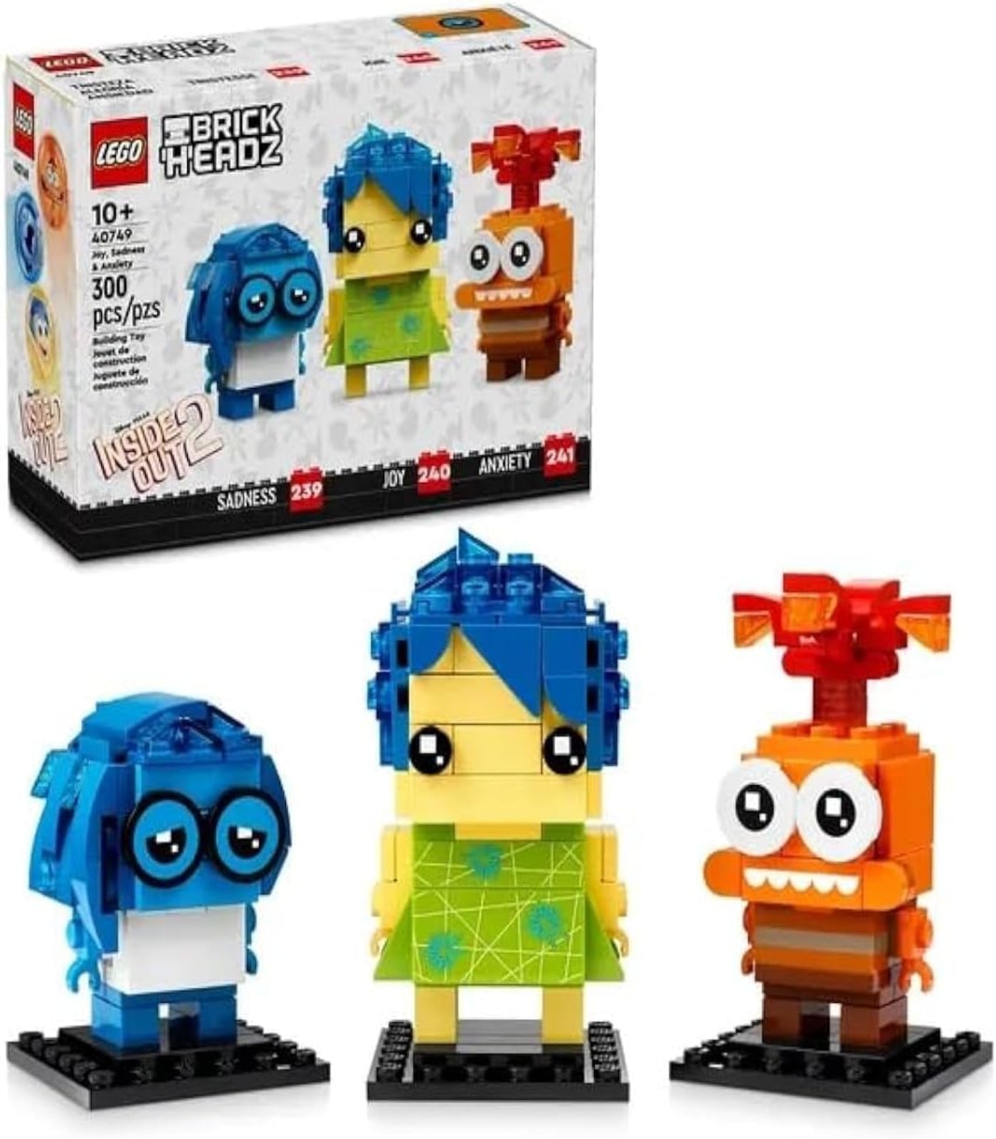 LEGO BrickHeadz set with three colorful characters in front of their packaging.