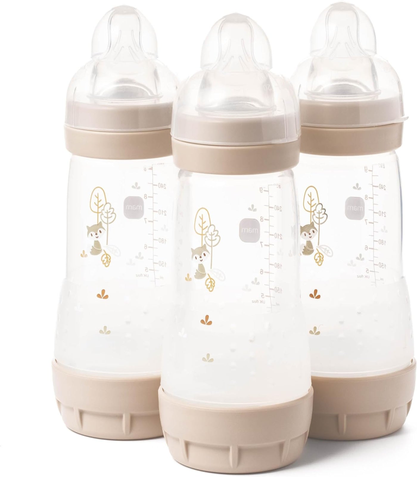 Three baby bottles with beige caps and bases on a white background