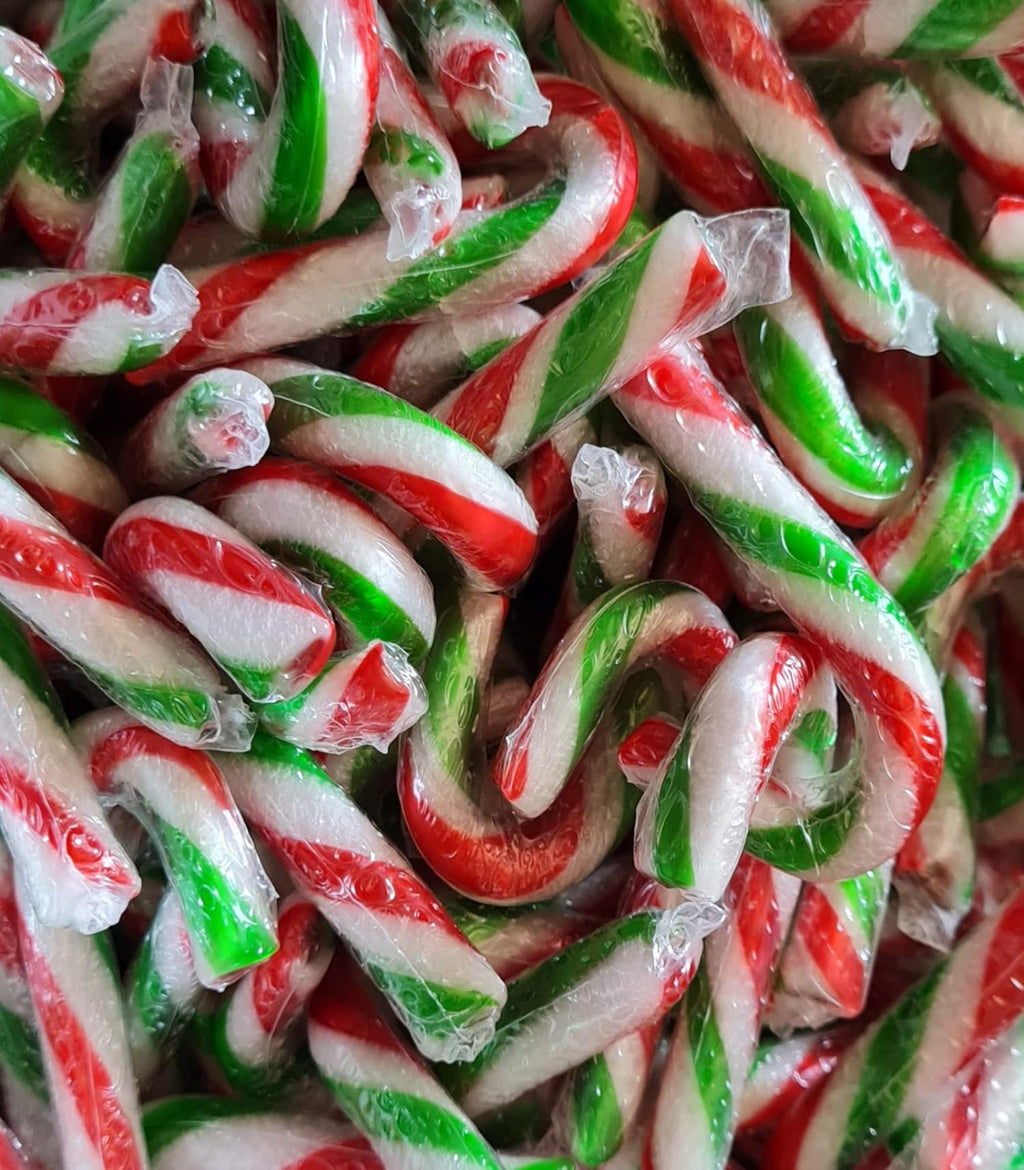 Close-up of a pile of red, green, and white candy canes.