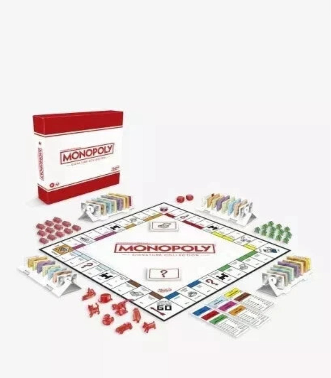 Monopoly board game set with pieces and box on a white background
