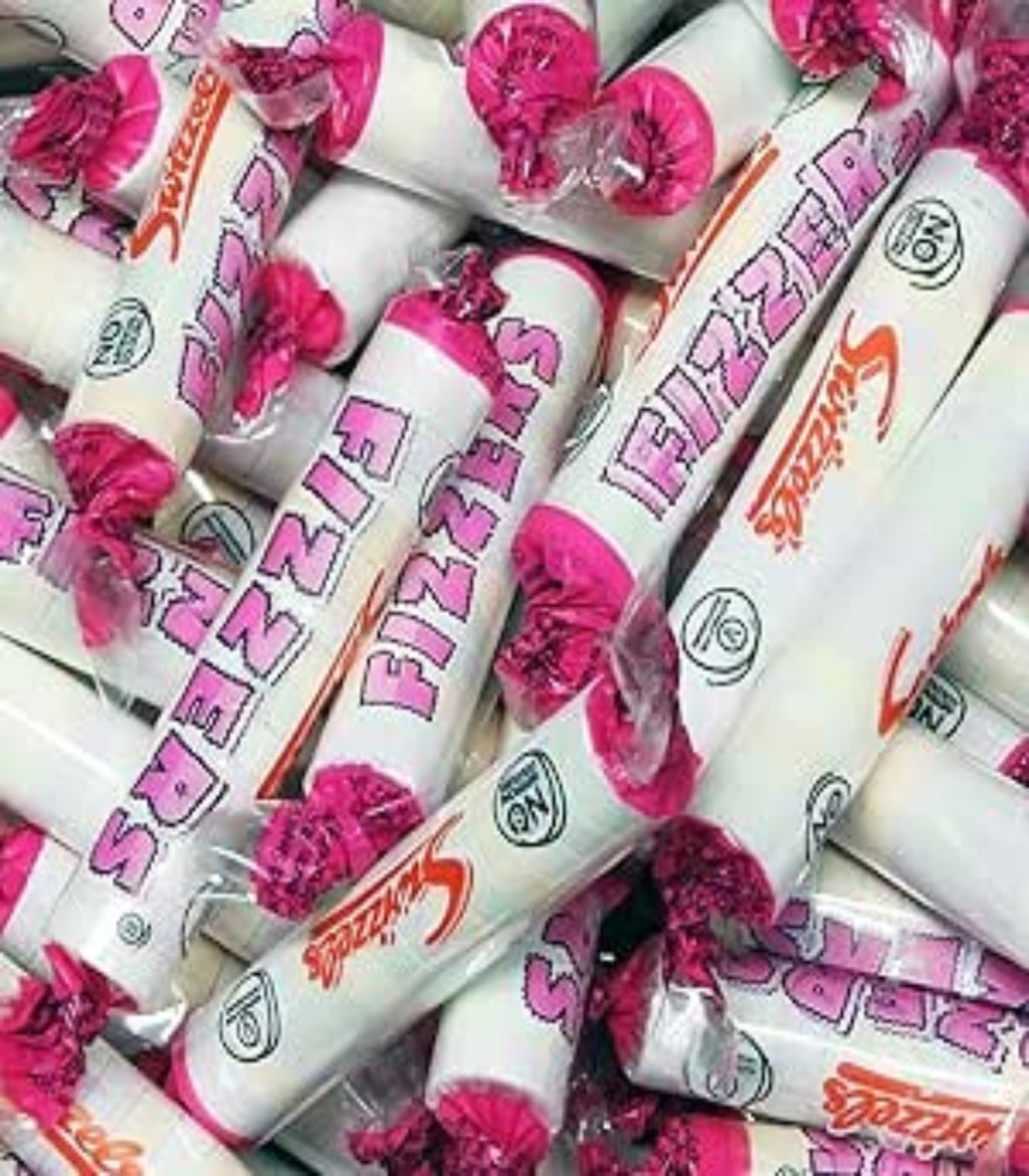 Piles of Fizzy's candy bars with pink wrappers.