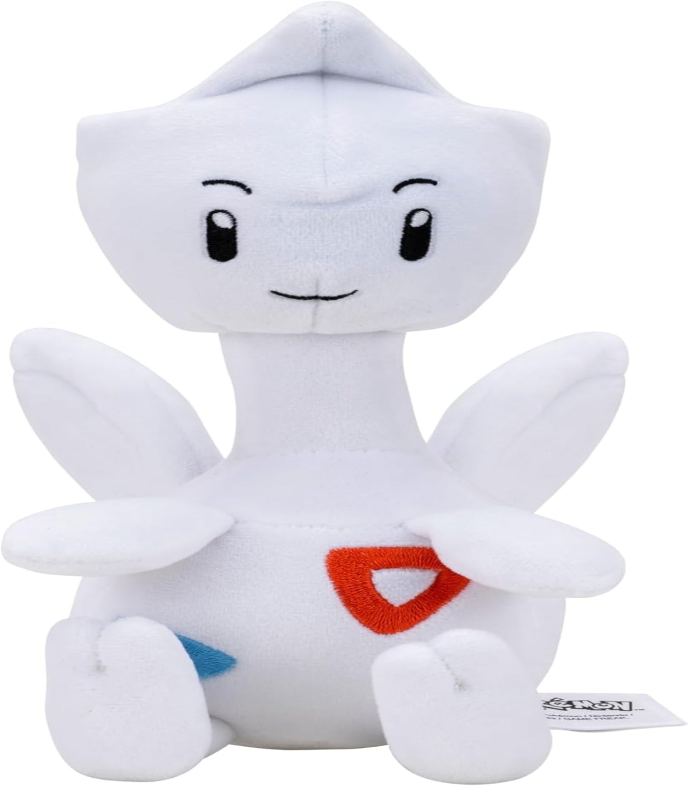 White plush toy with a red heart on a white background