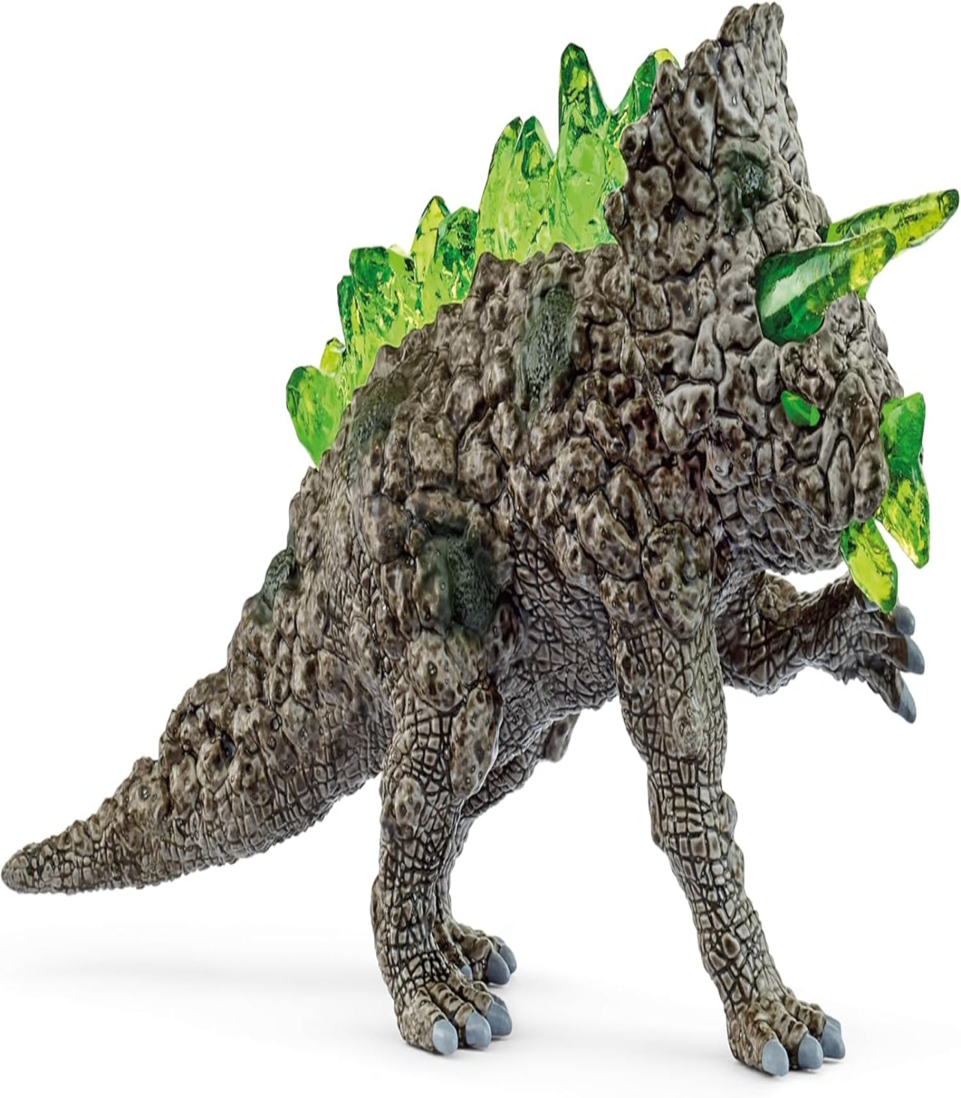 Toy dinosaur figure with a textured gray body and green spikes on a white background