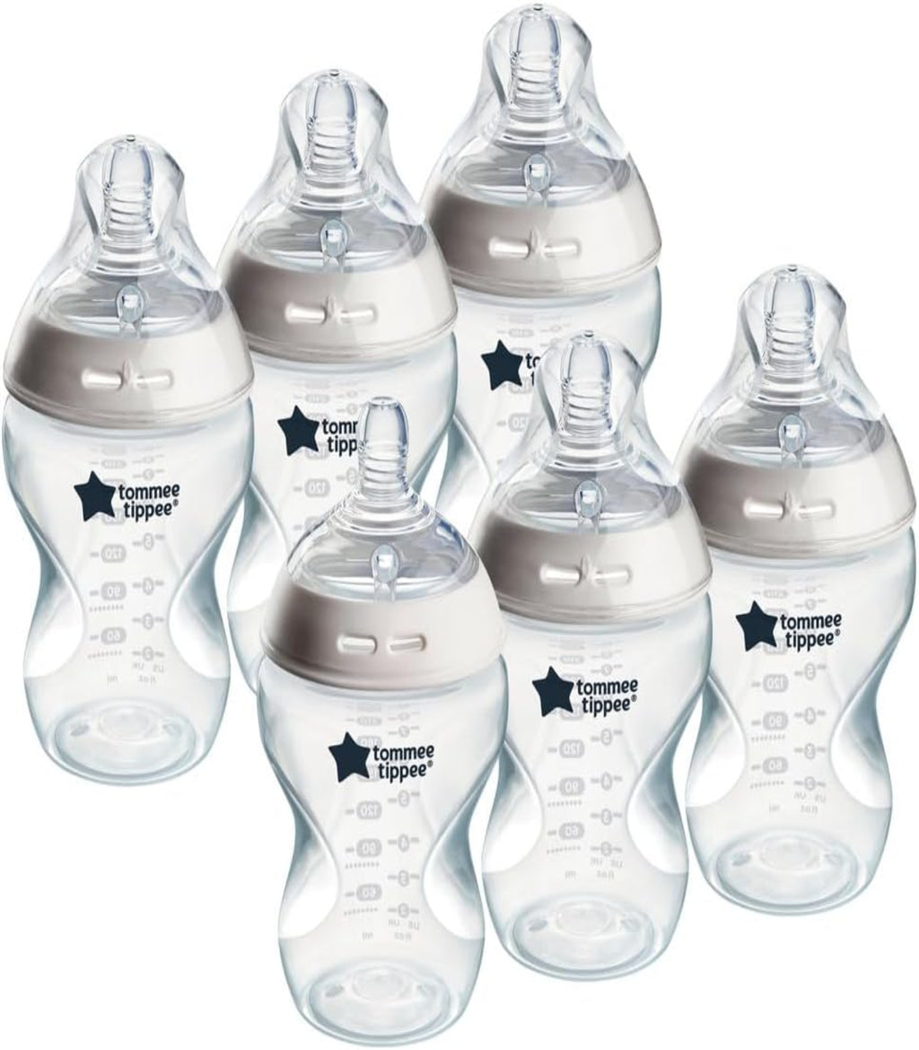 Set of six Tommee Tippee baby bottles on a white background