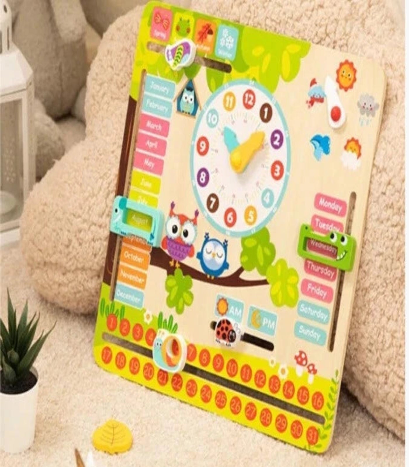 Children's educational board with clock and calendar on a soft surface